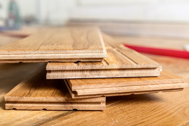 close up of hardwood flooring boards stacked on floor